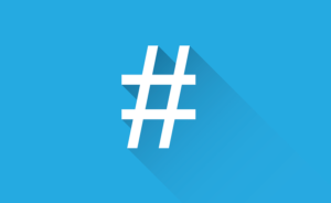 Instagram marketing concept: a white hashtag symbol displayed over a blue background 